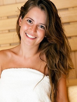 Young Woman Smiling Sitting in Infrared Sauna