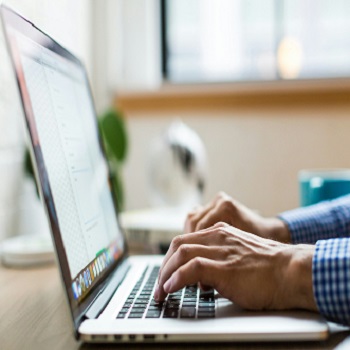 EMF Source Laptop Computer with Man Typing