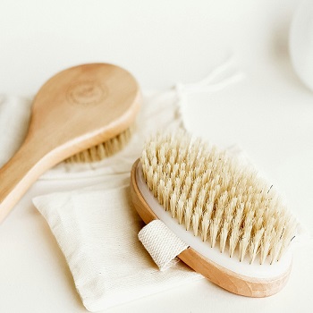 Two Natural Bristle Dry Brushes on Towel